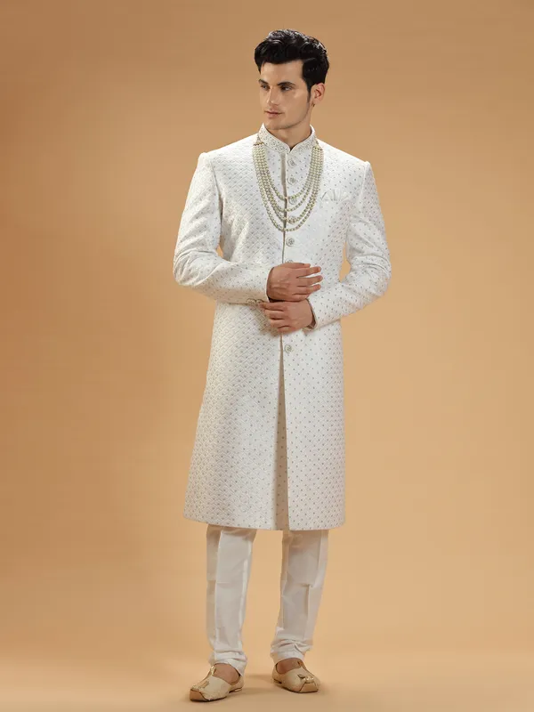 Stunning white silk groom sherwani