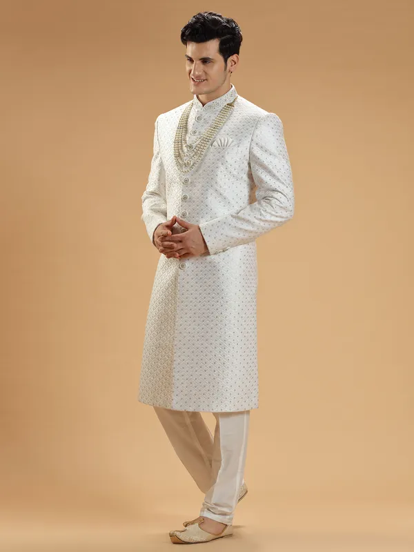 Stunning white silk groom sherwani