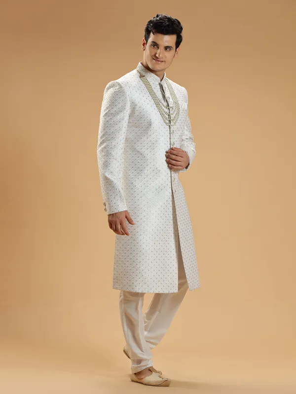 Stunning white silk groom sherwani