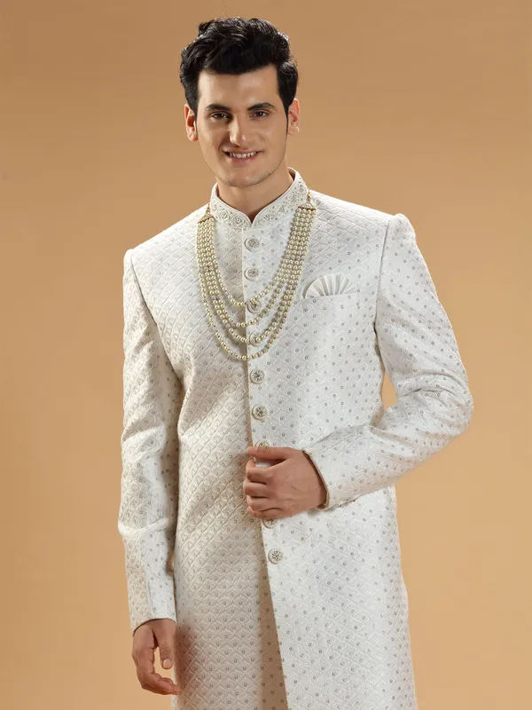 Stunning white silk groom sherwani