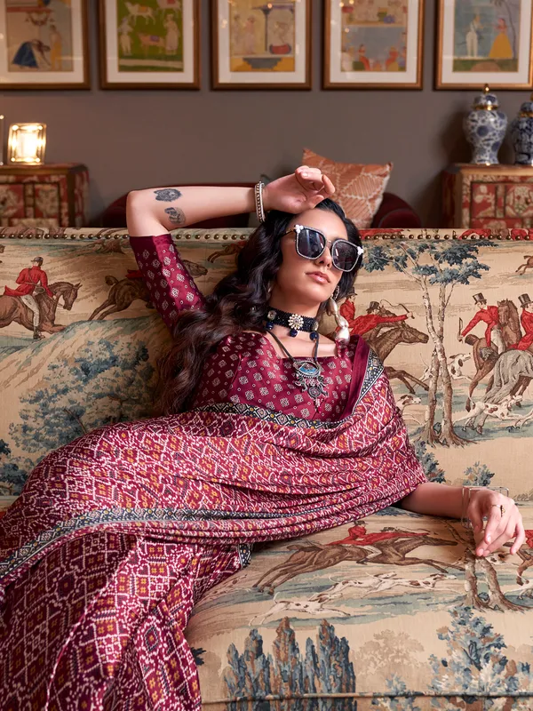 Stunning wine patola printed crepe saree