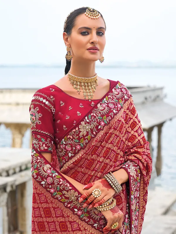 Stylish maroon bandhej and dola silk saree