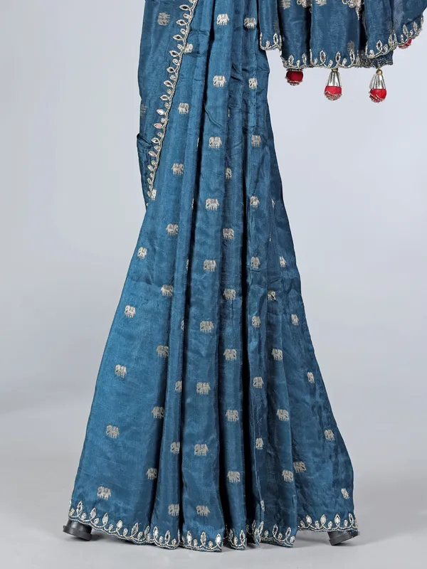 Teal blue dola silk saree with contrast red blouse