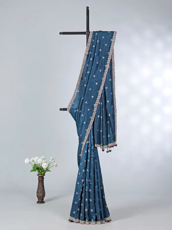 Teal blue festive wear dola silk saree with contrast pink blouse
