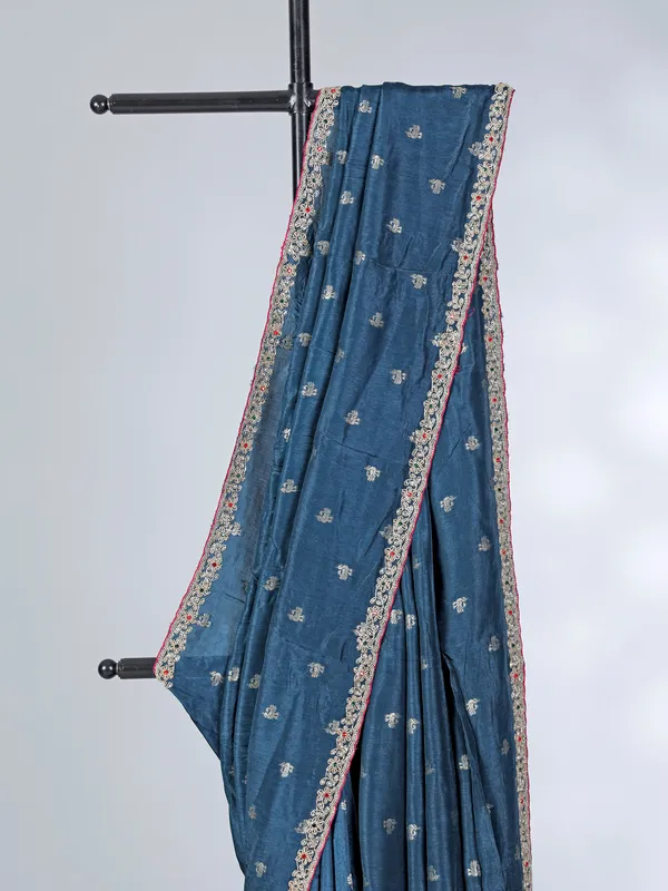 Teal blue festive wear dola silk saree with contrast pink blouse