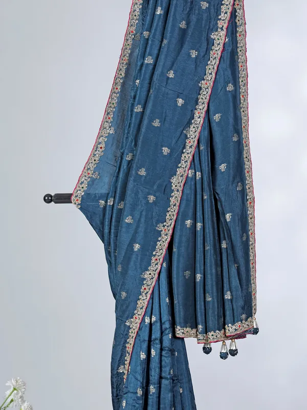 Teal blue festive wear dola silk saree with contrast pink blouse