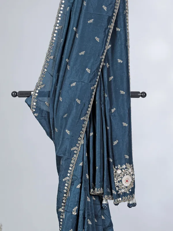Teal blue festive wear dola silk saree with cutdana embellishment