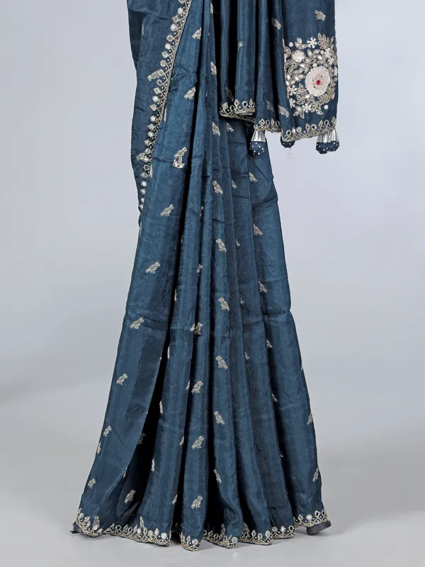Teal blue festive wear dola silk saree with cutdana embellishment