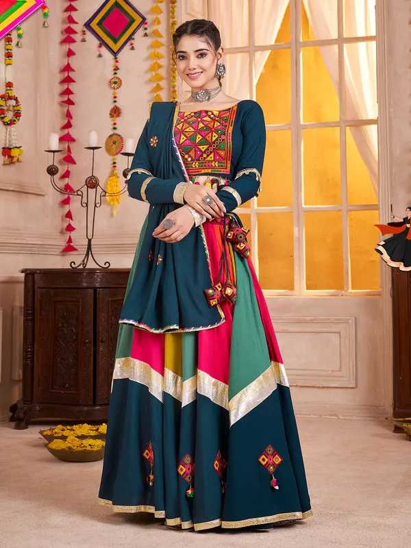 Teal blue navratri chaniya choli with beads and mirror work