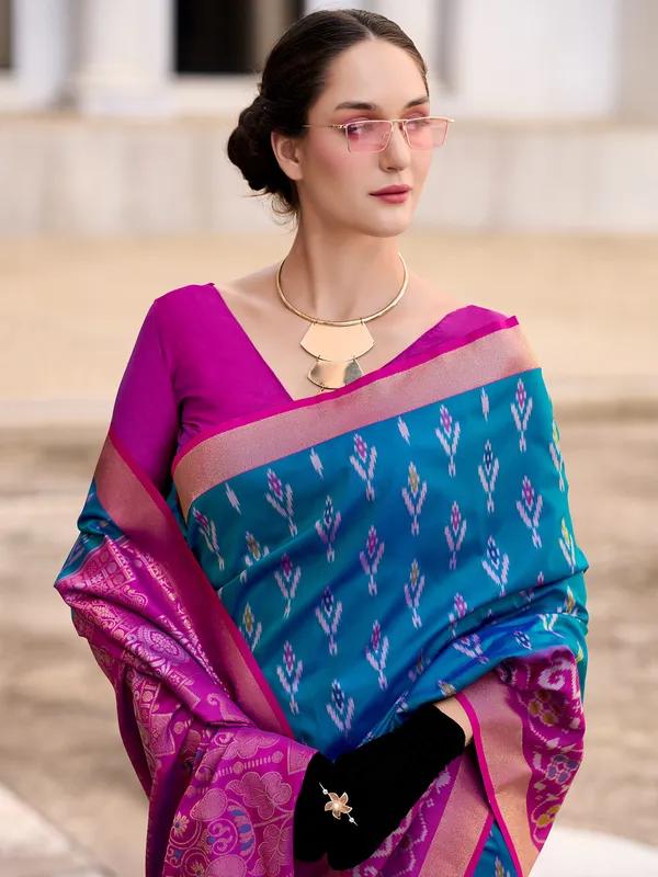 Teal blue saree with contrast border