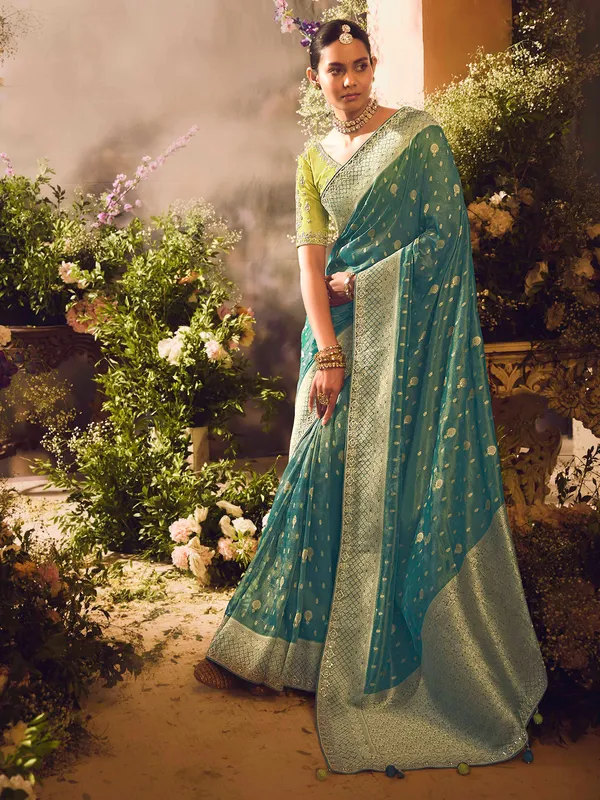 Teal blue saree with intricate banarasi embellishments