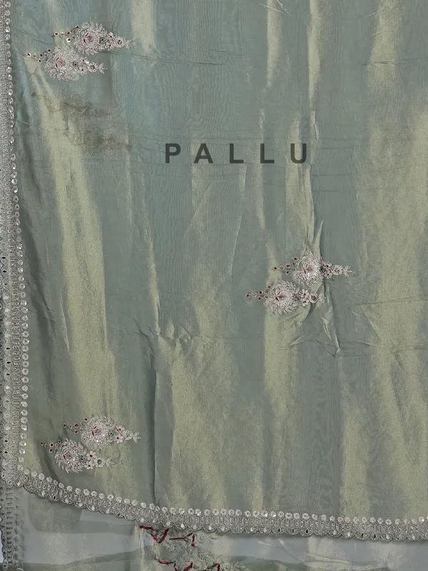 Teal blue tissue silk saree for festive glam