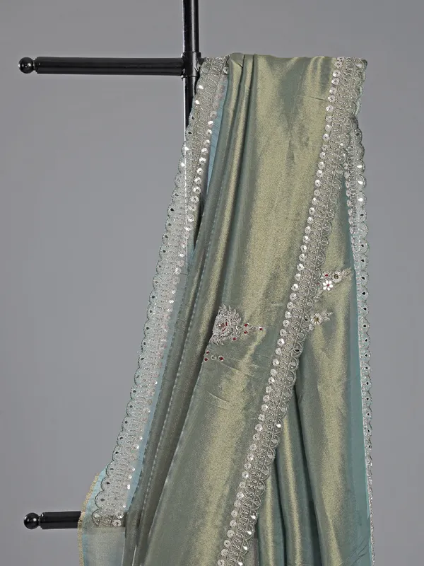 Teal blue tissue silk saree for festive glam