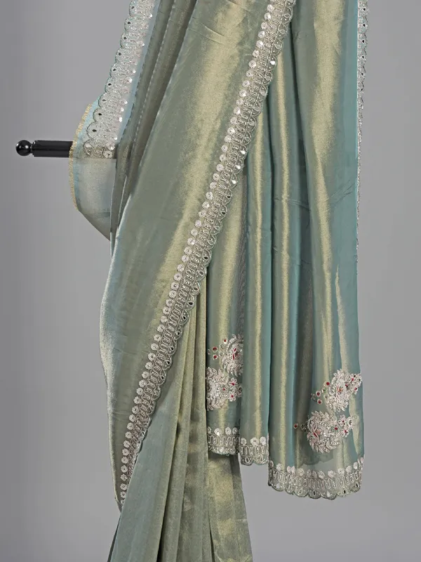Teal blue tissue silk saree for festive glam