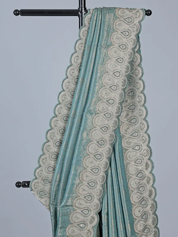 Teal blue tissue silk saree for festive wear