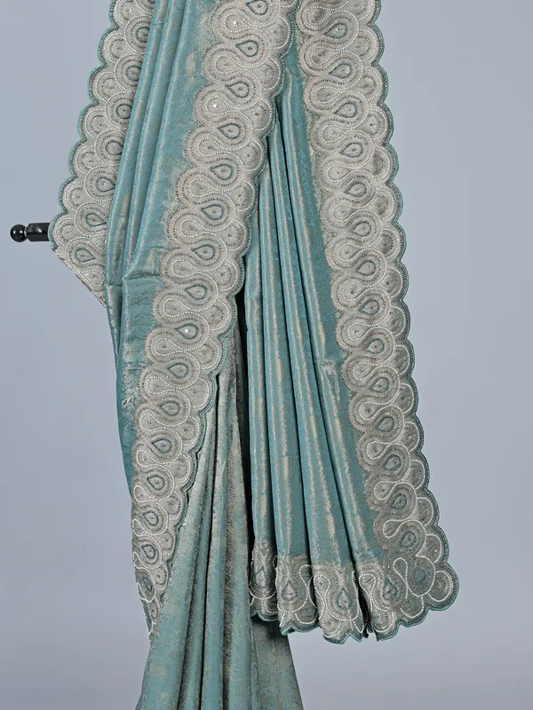 Teal blue tissue silk saree for festive wear