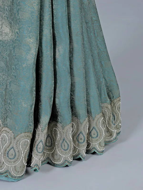 Teal blue tissue silk saree for festive wear