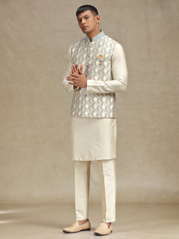 Cream and pista waistcoat set for festive occasions