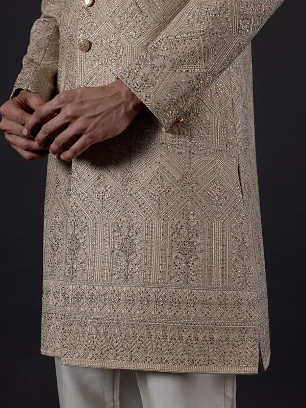 Traditional glimmerish beige silk sherwani for groom