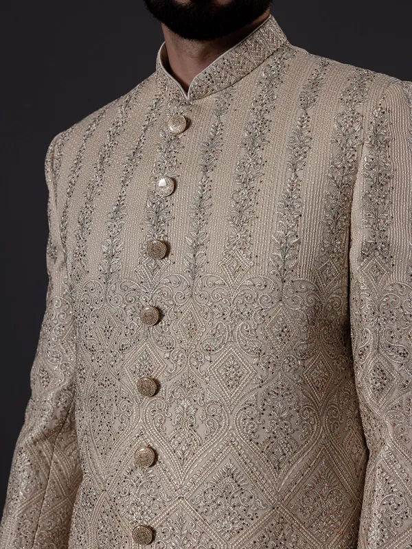 Traditional glimmerish beige silk sherwani for groom