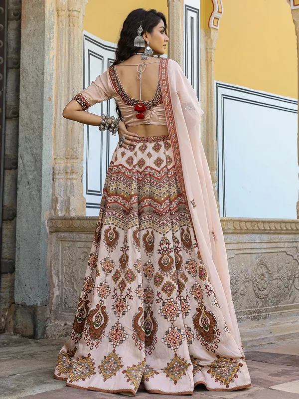Traditional white and peach silk lehenga choli in print