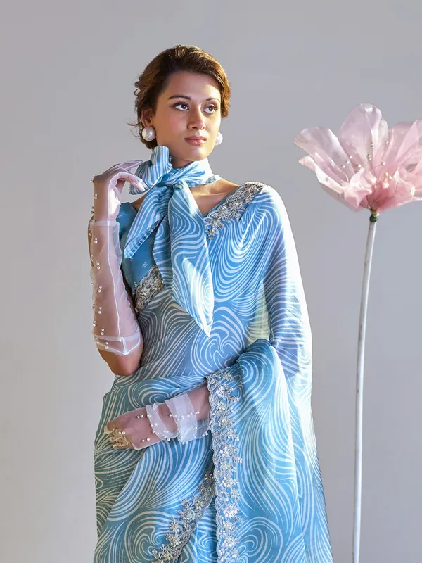 Trendy blue printed satin saree