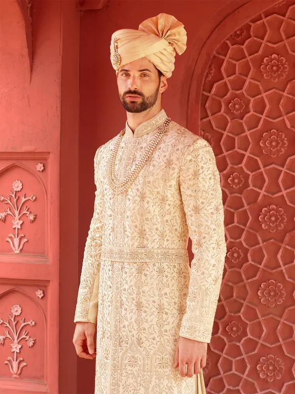 Trendy cream groom sherwani in raw silk