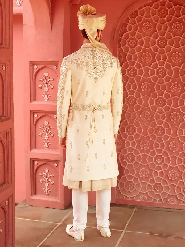 Trendy cream groom sherwani in raw silk