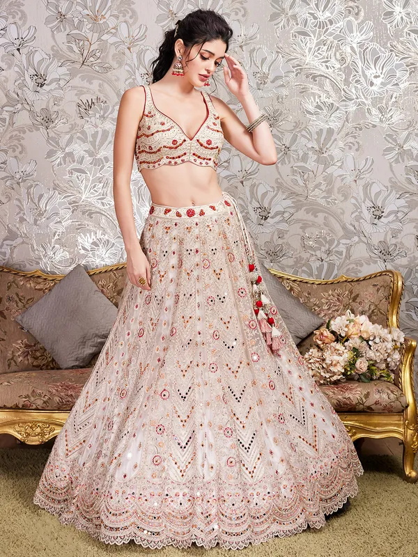Trendy cream net lehenga choli