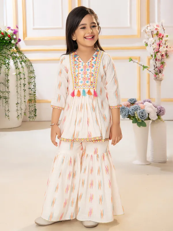 Trendy cream printed sharara suit in cotton