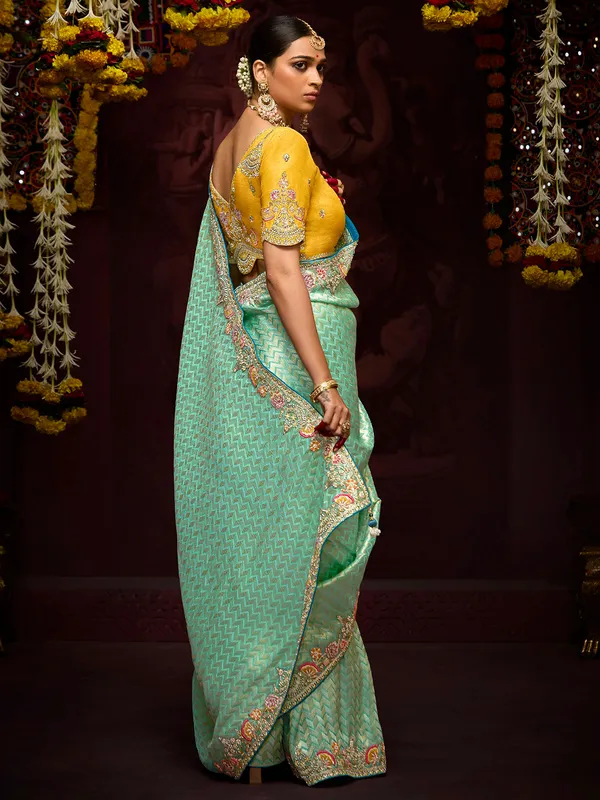 Trendy light green zari weaving saree