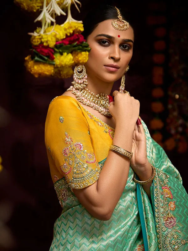 Trendy light green zari weaving saree
