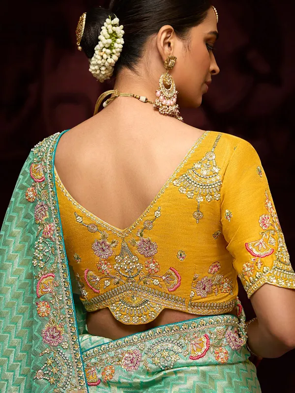 Trendy light green zari weaving saree