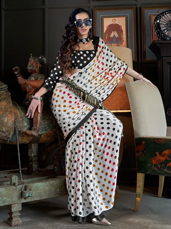 Trendy off-white crepe patola printed saree