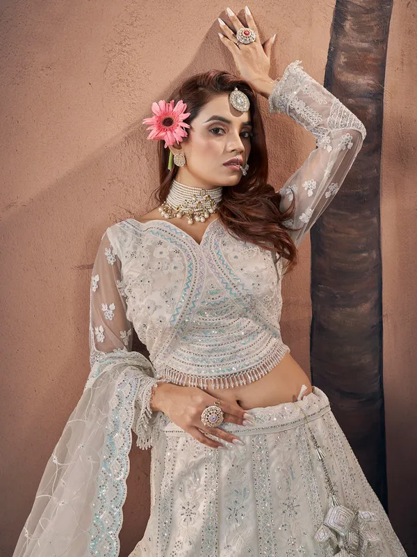 Trendy off-white net lehenga choli for bridal