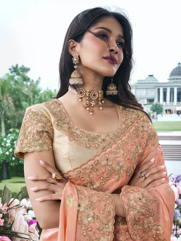 Trendy peach tissue silk saree for festive