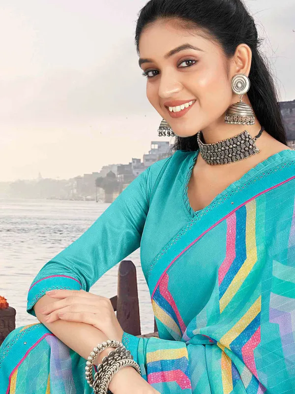 Trendy sky blue georgette saree