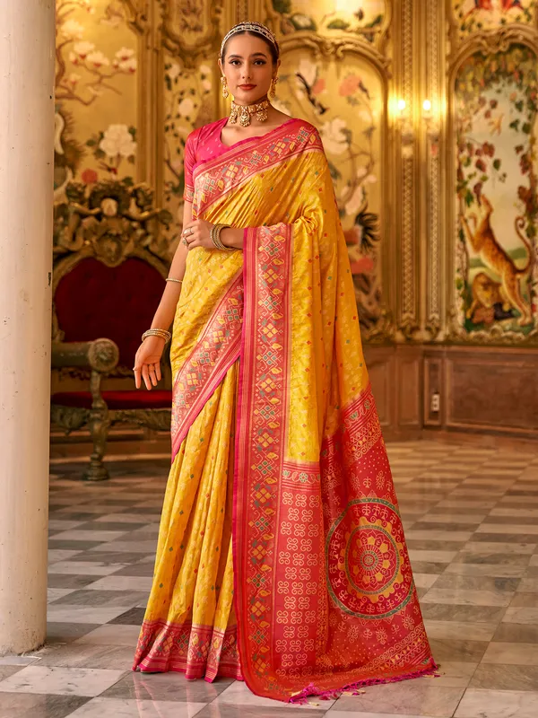 Trendy yellow printed banarasi silk saree