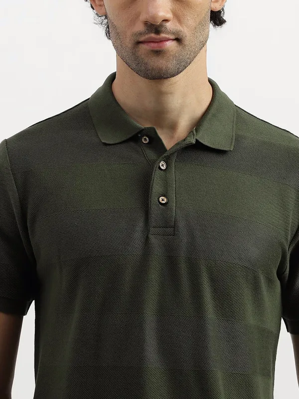 UCB dark green stripe t shirt