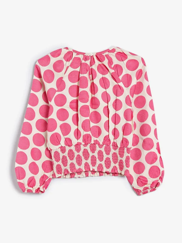UCB off white and pink printed top