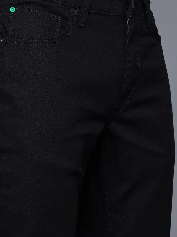 UCB solid black denim jeans with skinny fit