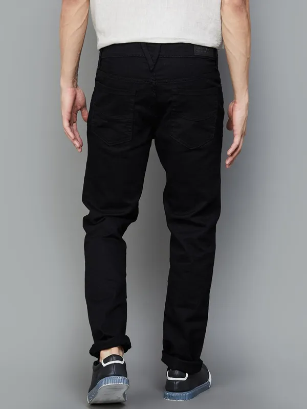 UCB solid black denim jeans with skinny fit