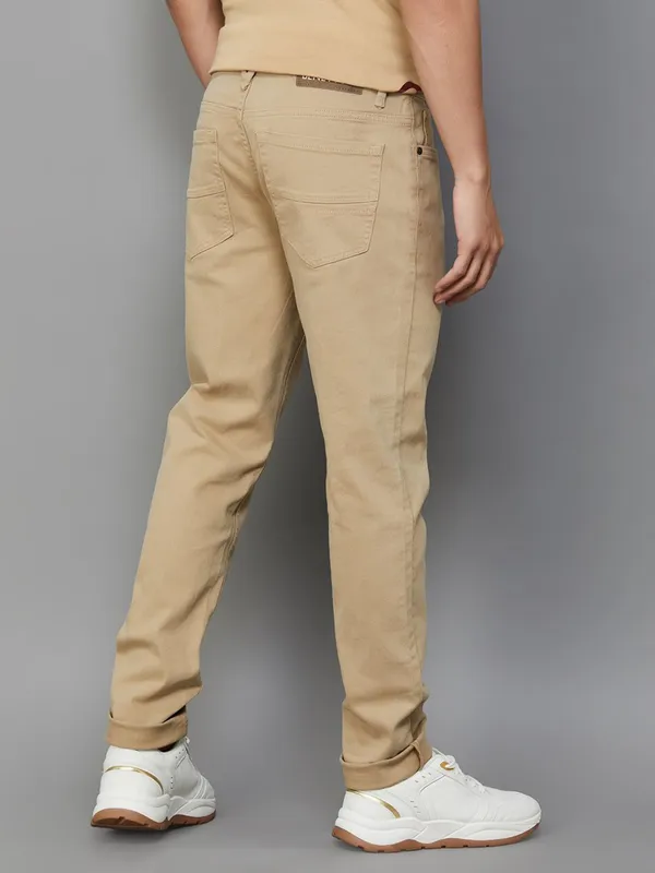 UCB solid khaki slim tapered fit denim jeans