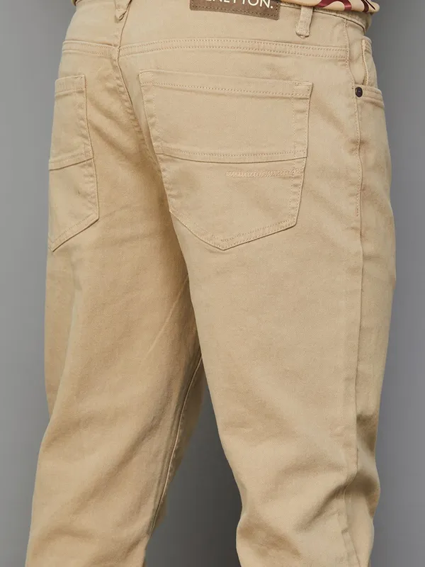 UCB solid khaki slim tapered fit denim jeans