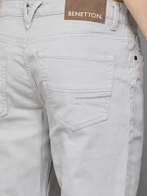UCB solid light grey slim tapered fit denim jeans