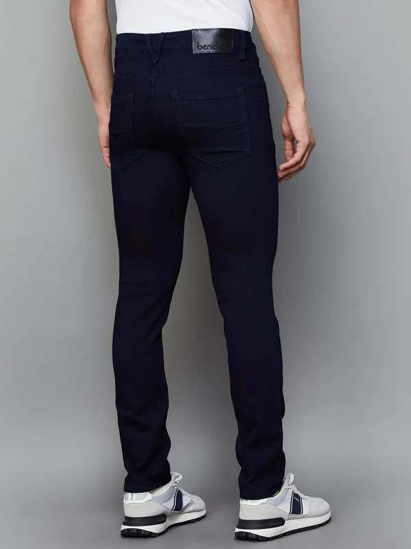 UCB solid navy slim tapered fit denim jeans for men