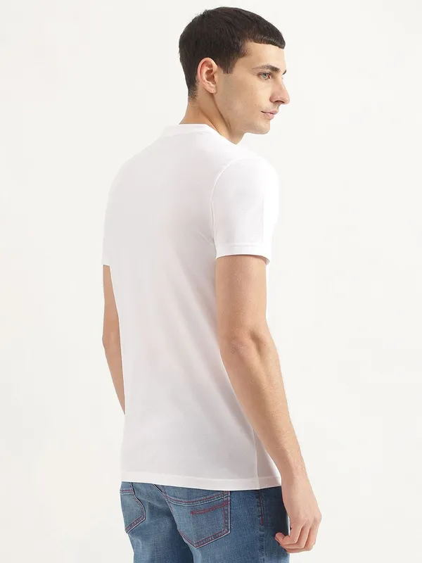 UCB white brand name cotton t-shirt
