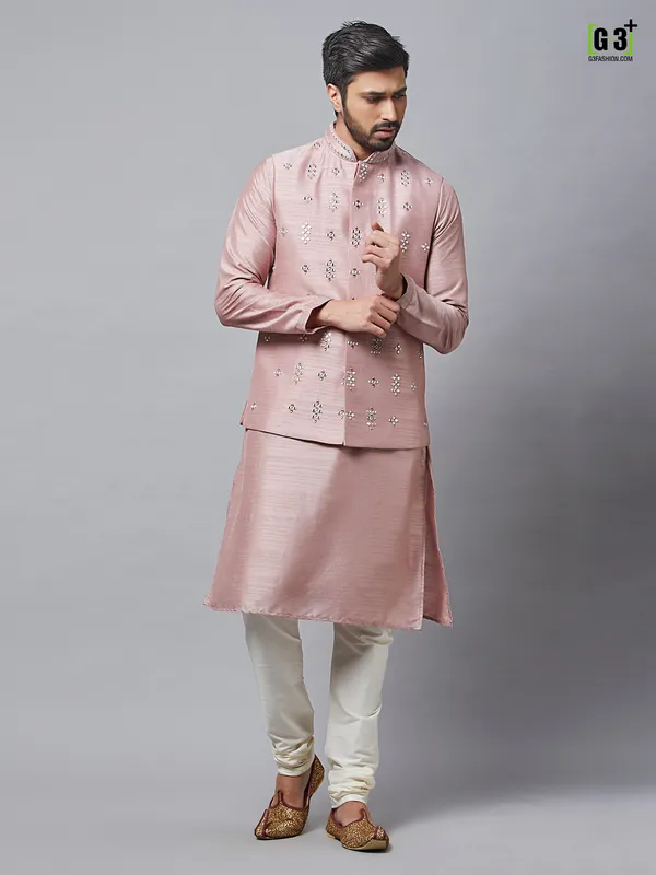 Waistcoat paired with onion pink raw silk kurta suit