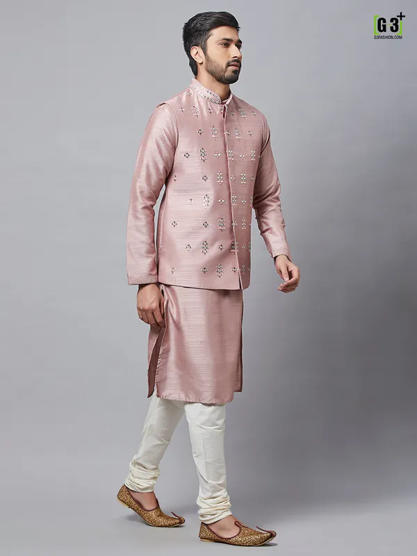 Waistcoat paired with onion pink raw silk kurta suit