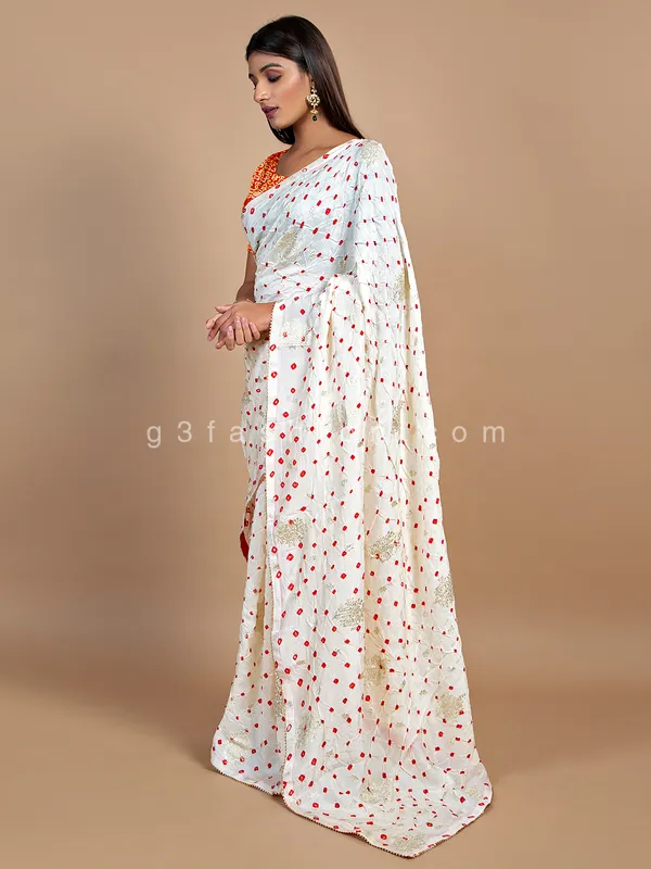 Wedding wear cream bandhej saree